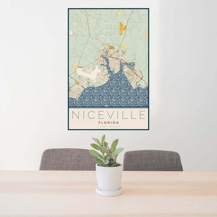 24x36 Niceville Florida Map Print Portrait Orientation in Woodblock Style Behind 2 Chairs Table and Potted Plant