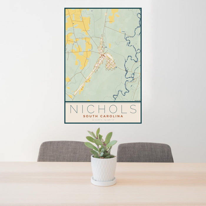 24x36 Nichols South Carolina Map Print Portrait Orientation in Woodblock Style Behind 2 Chairs Table and Potted Plant