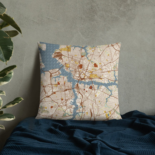 Custom Norfolk Virginia Map Throw Pillow in Woodblock on Bedding Against Wall
