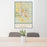 24x36 Norman Oklahoma Map Print Portrait Orientation in Woodblock Style Behind 2 Chairs Table and Potted Plant