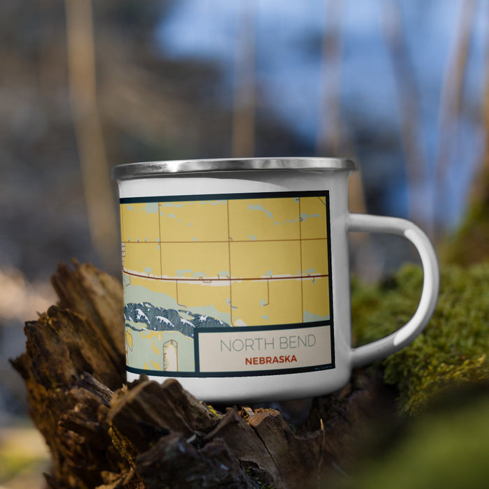 Right View Custom North Bend Nebraska Map Enamel Mug in Woodblock on Grass With Trees in Background
