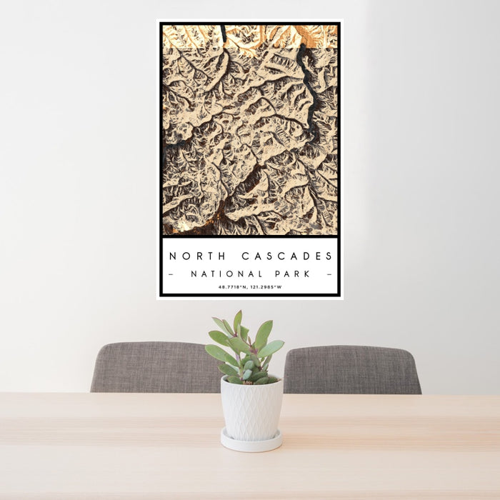 24x36 North Cascades National Park Map Print Portrait Orientation in Ember Style Behind 2 Chairs Table and Potted Plant
