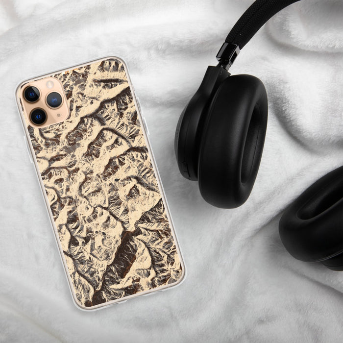 Custom North Cascades National Park Map Phone Case in Ember on Table with Black Headphones