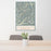 24x36 North Cascades National Park Map Print Portrait Orientation in Woodblock Style Behind 2 Chairs Table and Potted Plant