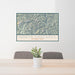 24x36 North Cascades National Park Map Print Landscape Orientation in Woodblock Style Behind 2 Chairs Table and Potted Plant