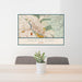 24x36 North End Boise Map Print Lanscape Orientation in Woodblock Style Behind 2 Chairs Table and Potted Plant
