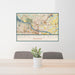 24x36 North Little Rock Arkansas Map Print Lanscape Orientation in Woodblock Style Behind 2 Chairs Table and Potted Plant
