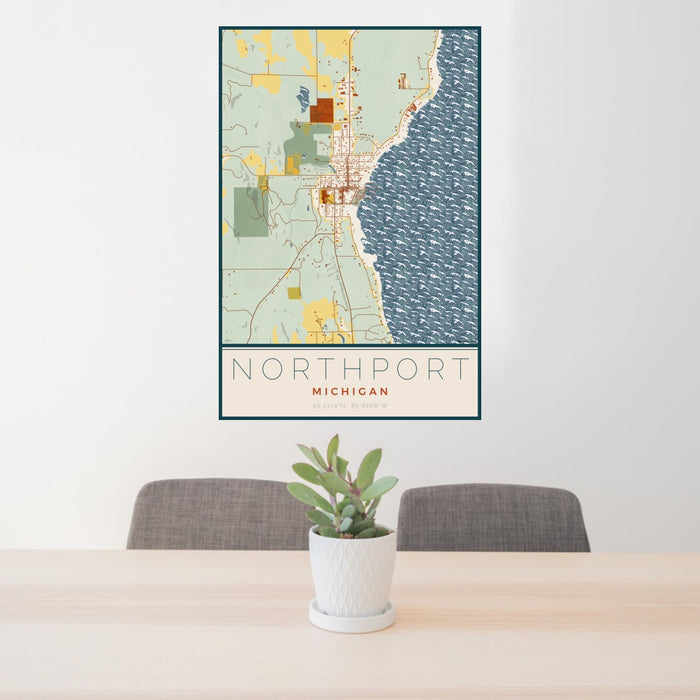 24x36 Northport Michigan Map Print Portrait Orientation in Woodblock Style Behind 2 Chairs Table and Potted Plant