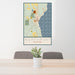 24x36 Northport Michigan Map Print Portrait Orientation in Woodblock Style Behind 2 Chairs Table and Potted Plant