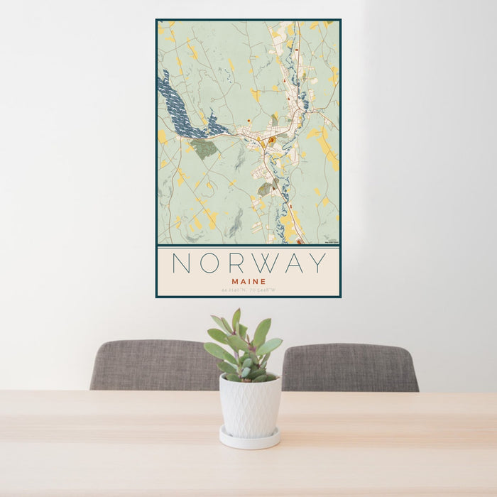 24x36 Norway Maine Map Print Portrait Orientation in Woodblock Style Behind 2 Chairs Table and Potted Plant