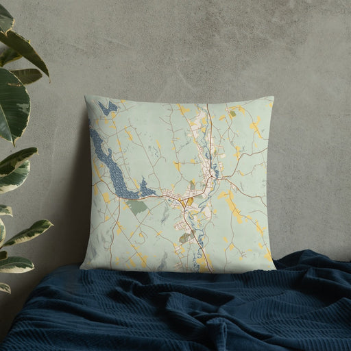 Custom Norway Maine Map Throw Pillow in Woodblock on Bedding Against Wall