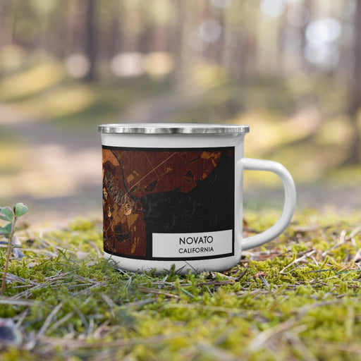 Right View Custom Novato California Map Enamel Mug in Ember on Grass With Trees in Background