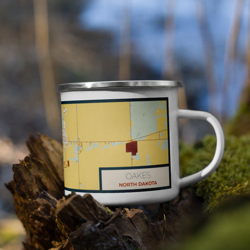 Right View Custom Oakes North Dakota Map Enamel Mug in Woodblock on Grass With Trees in Background