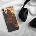 Custom Oakland California Map Phone Case in Ember on Table with Black Headphones
