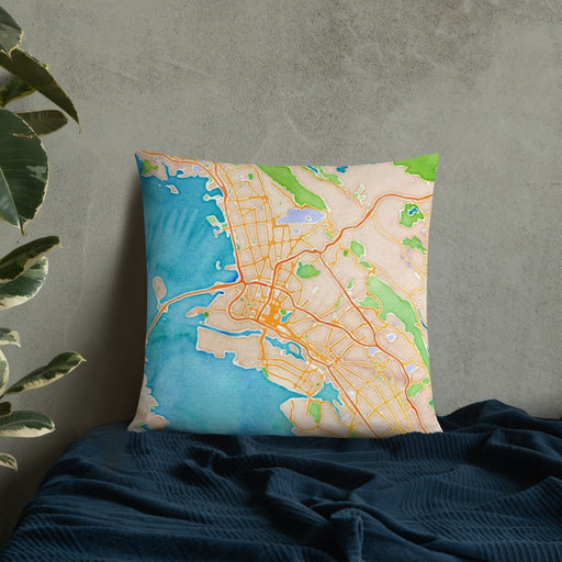 Custom Oakland California Map Throw Pillow in Watercolor on Bedding Against Wall