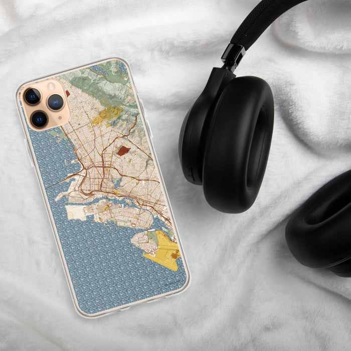 Custom Oakland California Map Phone Case in Woodblock on Table with Black Headphones