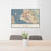 24x36 Oakland California Map Print Landscape Orientation in Woodblock Style Behind 2 Chairs Table and Potted Plant