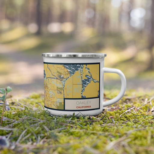 Right View Custom Oakley California Map Enamel Mug in Woodblock on Grass With Trees in Background