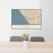 24x36 Oceanside California Map Print Landscape Orientation in Woodblock Style Behind 2 Chairs Table and Potted Plant