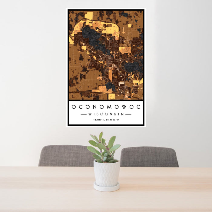 24x36 Oconomowoc Wisconsin Map Print Portrait Orientation in Ember Style Behind 2 Chairs Table and Potted Plant