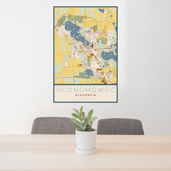 24x36 Oconomowoc Wisconsin Map Print Portrait Orientation in Woodblock Style Behind 2 Chairs Table and Potted Plant