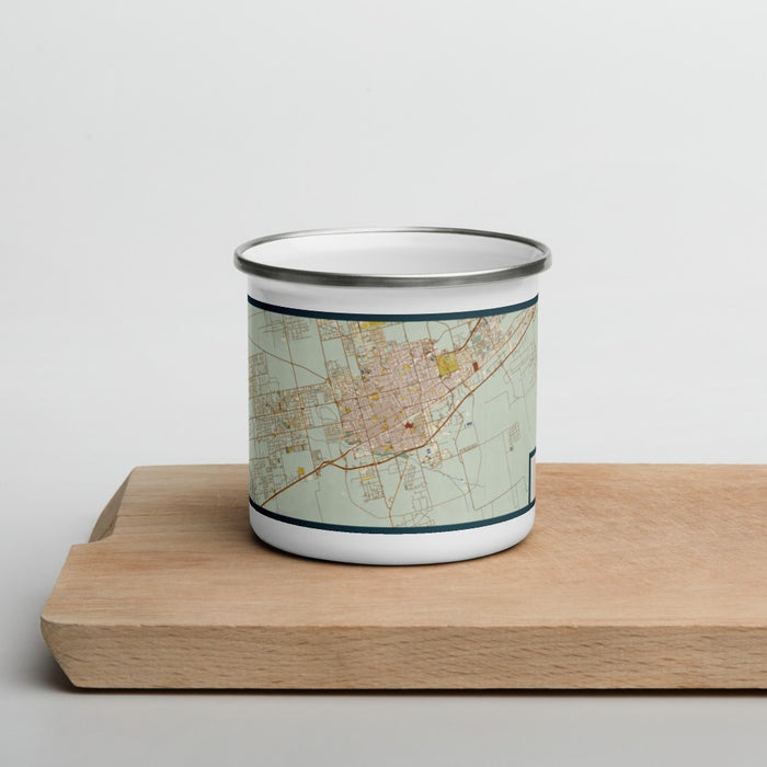 Front View Custom Odessa Texas Map Enamel Mug in Woodblock on Cutting Board