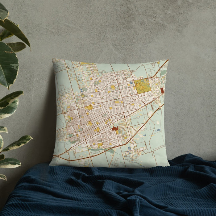 Custom Odessa Texas Map Throw Pillow in Woodblock on Bedding Against Wall