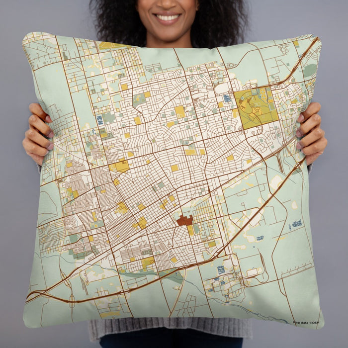 Person holding 22x22 Custom Odessa Texas Map Throw Pillow in Woodblock