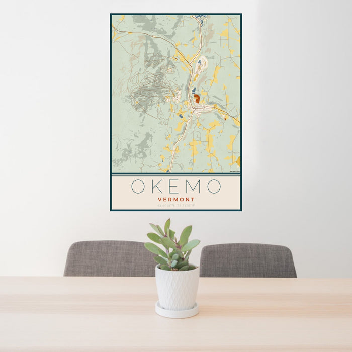 24x36 Okemo Vermont Map Print Portrait Orientation in Woodblock Style Behind 2 Chairs Table and Potted Plant