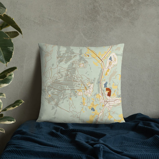 Custom Okemo Vermont Map Throw Pillow in Woodblock on Bedding Against Wall