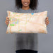 Person holding 20x12 Custom Okemos Michigan Map Throw Pillow in Watercolor