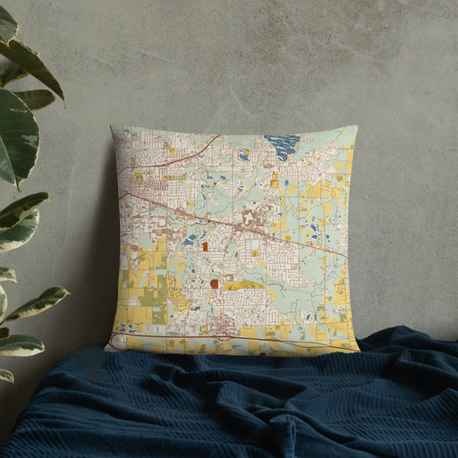 Custom Okemos Michigan Map Throw Pillow in Woodblock on Bedding Against Wall