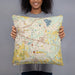 Person holding 18x18 Custom Okemos Michigan Map Throw Pillow in Woodblock