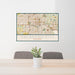 24x36 Oklahoma City Oklahoma Map Print Landscape Orientation in Woodblock Style Behind 2 Chairs Table and Potted Plant