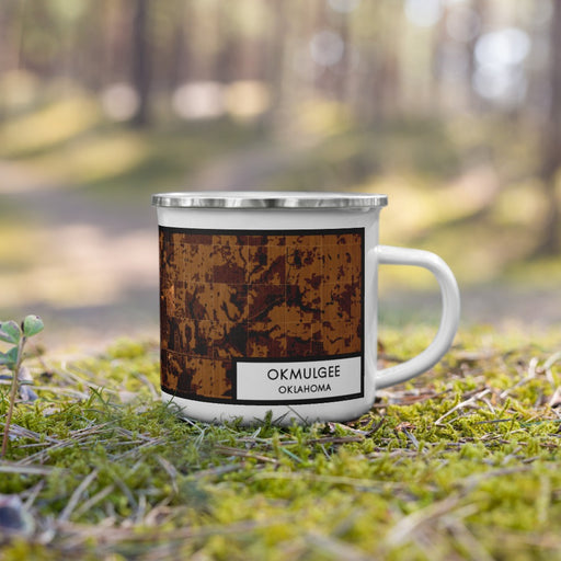 Right View Custom Okmulgee Oklahoma Map Enamel Mug in Ember on Grass With Trees in Background