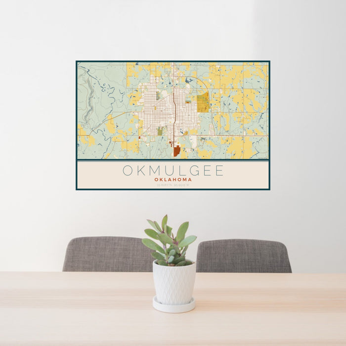 24x36 Okmulgee Oklahoma Map Print Landscape Orientation in Woodblock Style Behind 2 Chairs Table and Potted Plant