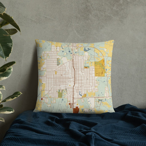 Custom Okmulgee Oklahoma Map Throw Pillow in Woodblock on Bedding Against Wall
