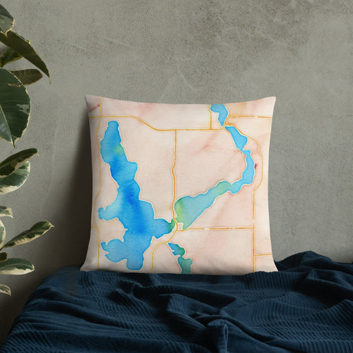 Custom Okoboji Iowa Map Throw Pillow in Watercolor on Bedding Against Wall