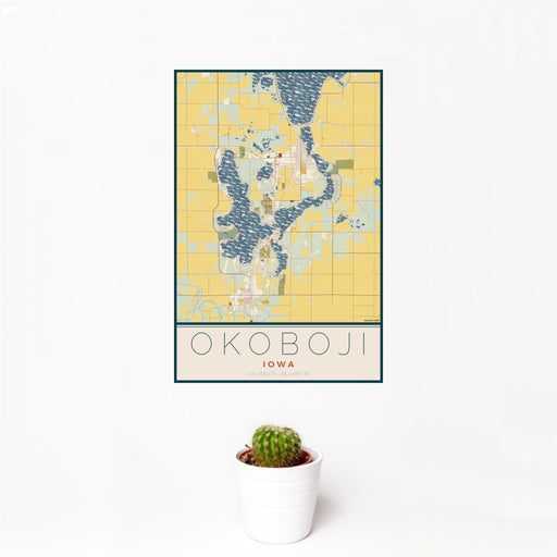 12x18 Okoboji Iowa Map Print Portrait Orientation in Woodblock Style With Small Cactus Plant in White Planter