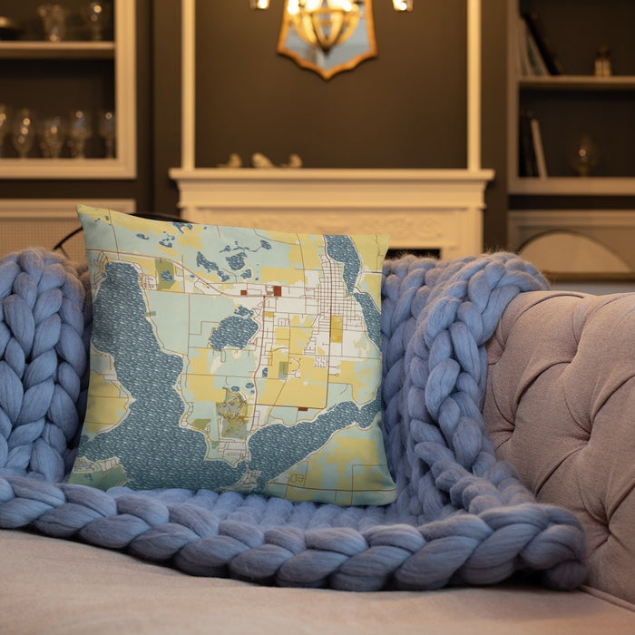Custom Okoboji Iowa Map Throw Pillow in Woodblock on Cream Colored Couch