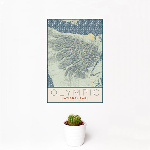12x18 Olympic National Park Map Print Portrait Orientation in Woodblock Style With Small Cactus Plant in White Planter