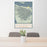 24x36 Olympic National Park Map Print Portrait Orientation in Woodblock Style Behind 2 Chairs Table and Potted Plant