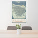 24x36 Olympic National Park Map Print Portrait Orientation in Woodblock Style Behind 2 Chairs Table and Potted Plant