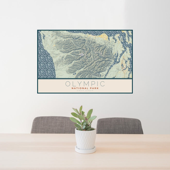 24x36 Olympic National Park Map Print Landscape Orientation in Woodblock Style Behind 2 Chairs Table and Potted Plant