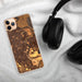 Custom Omaha Nebraska Map Phone Case in Ember on Table with Black Headphones