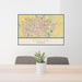 24x36 Omaha Nebraska Map Print Landscape Orientation in Woodblock Style Behind 2 Chairs Table and Potted Plant