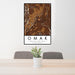 24x36 Omak Washington Map Print Portrait Orientation in Ember Style Behind 2 Chairs Table and Potted Plant