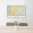 24x36 Omak Washington Map Print Lanscape Orientation in Woodblock Style Behind 2 Chairs Table and Potted Plant