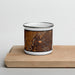 Front View Custom Omak Washington Map Enamel Mug in Ember on Cutting Board