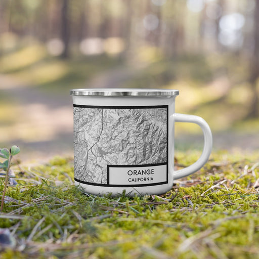 Right View Custom Orange California Map Enamel Mug in Classic on Grass With Trees in Background